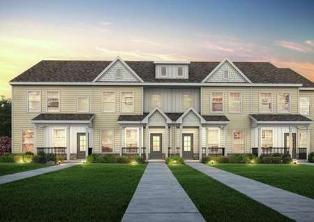 Straight on view of the Huntington Point townhomes at dusk