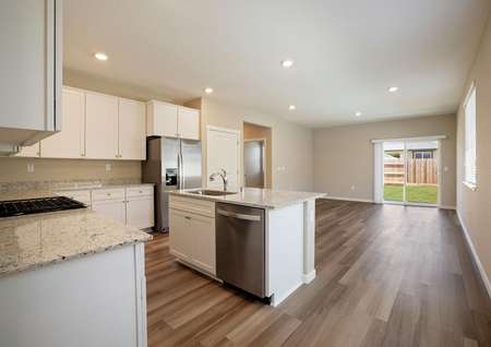 The kitchen overlooks the family room in this layout.