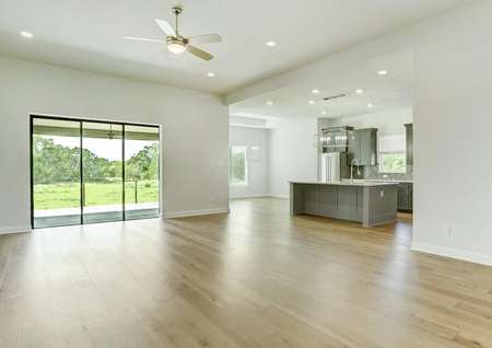 This home has a bright, open layout with large windows and wood flooring.