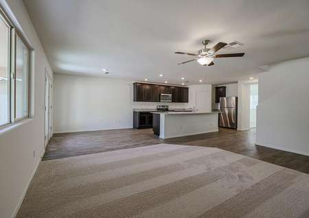 Open-concept layout, featuring a chef-ready kitchen, dining area, and spacious family room.