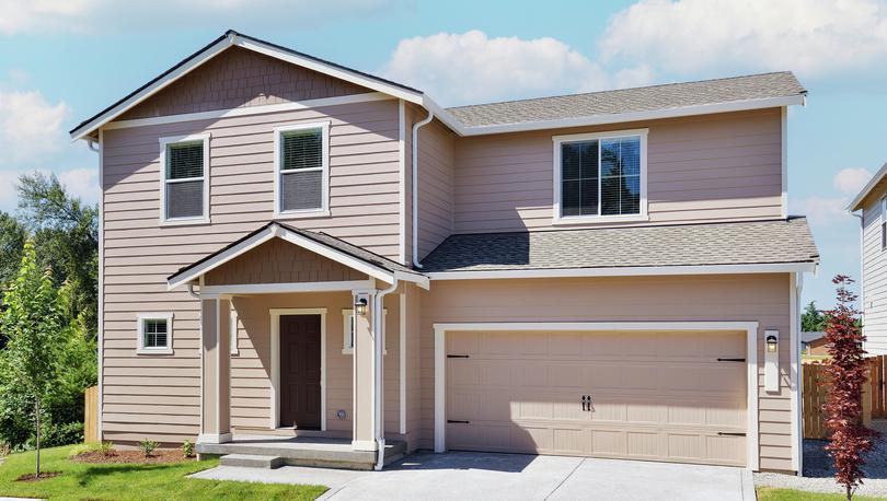 Two story home with siding and front yard landscaping