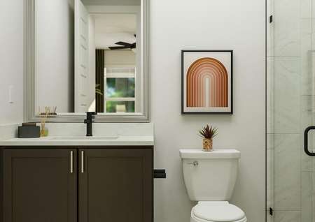 Rendering of the secondary bathroom  showcasing a modern vanity, toilet, and glass framed shower.