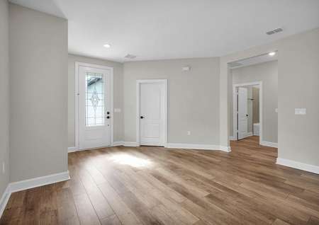 The foyer of the Halifax home showcases luxury vinyl plank flooring, recessed lighting and a decorative front door.