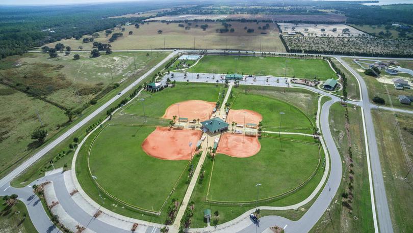 Drone view of the Poinciana community amenities, the park and some of the homes that are around it.
