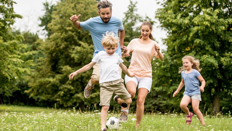 Active family play soccer in their leisure time