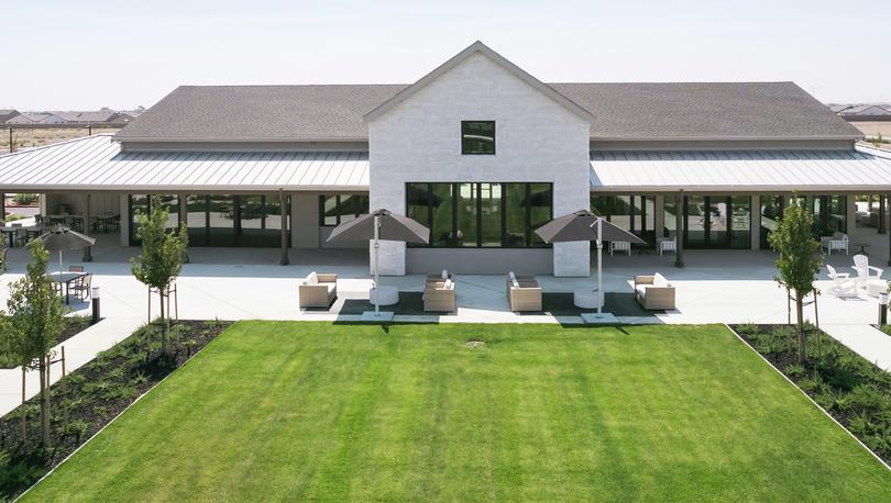 The Ranch House at Club Liberty with several sitting areas and greenery.