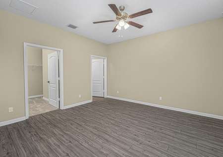 The master bedroom is spacious with a large walk-in closet and easy access to its own bathroom