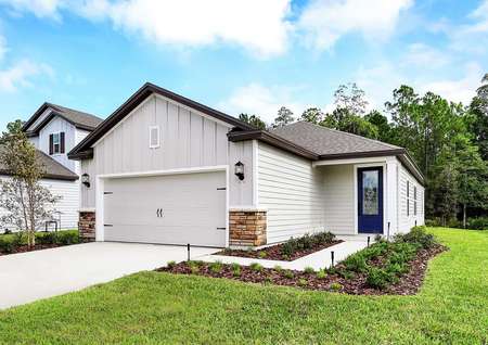 Exterior front view of the Alafia floor plan that has a beautifully landscaped front yard.