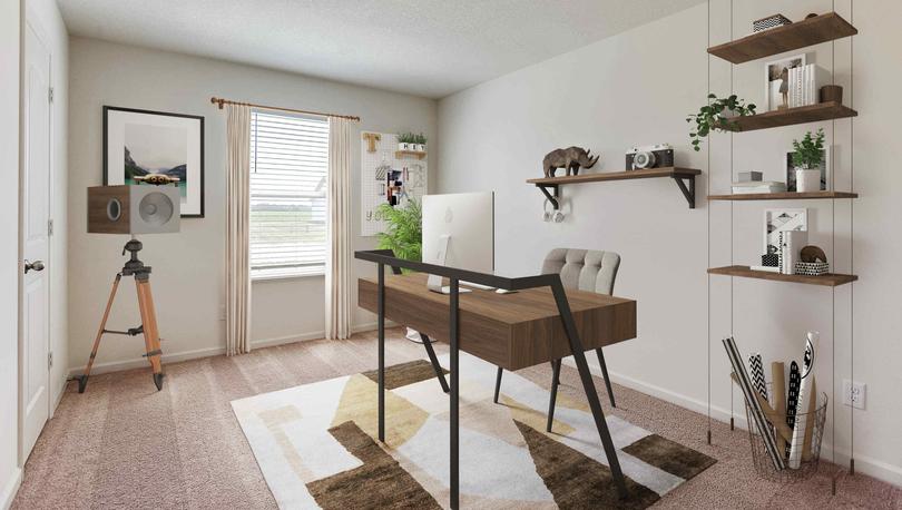 Staged home office in bedroom with carpet and one window, desk and floating suspended shelving unit.