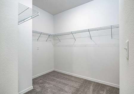 A large walk-in closet with plenty of storage space, located in the master retreat.