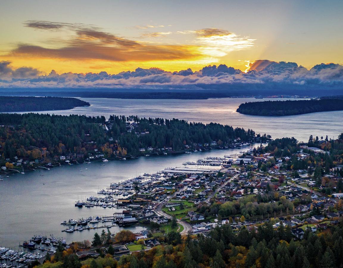 Tacoma, Washington Gig Harbor at sunrise showing water inlets, town, and forest area