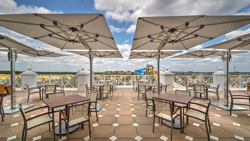 View from the second-story deck of a clubhouse restaurant overlooking the resort's waterslides. 