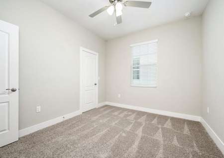 The spare bedroom is spacious and has plenty of natural light