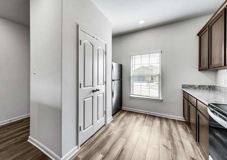 Stunning kitchen with upgrades such as granite countertops and included appliances. 