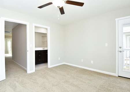Master bedroom with a ceiling fan