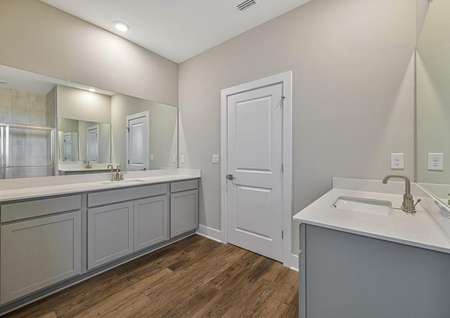 The master bath has one large vanity and and secondary vanity with another sink