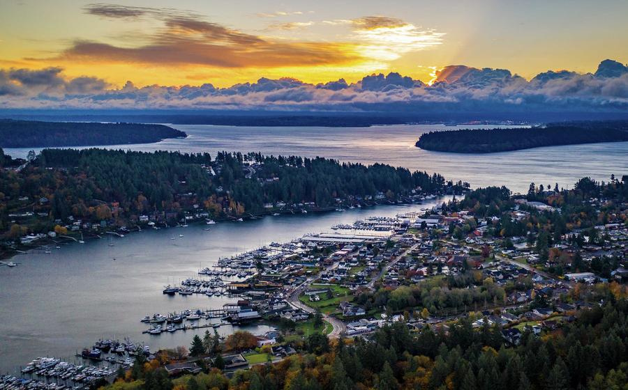 Tacoma, Washington Gig Harbor at sunrise showing water inlets, town, and forest area
